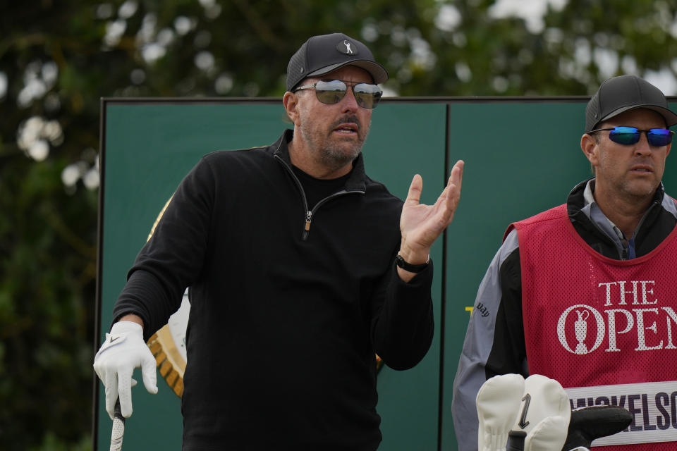 Phil Mickelson of the US prepares to play from the 3rd tee during the first round of the British Open golf championship on the Old Course at St. Andrews, Scotland, Thursday, July 14 2022. The Open Championship returns to the home of golf on July 14-17, 2022, to celebrate the 150th edition of the sport's oldest championship, which dates to 1860 and was first played at St. Andrews in 1873. (AP Photo/Alastair Grant)