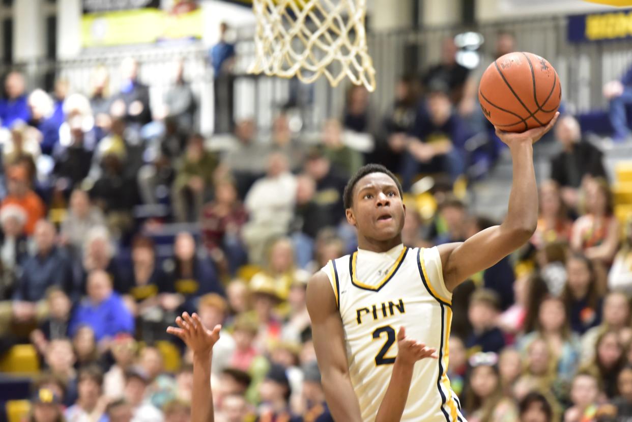 Port Huron Northern's Amir Morelan goes for a layup during a game earlier this season. He finished with 22 points and 10 assists in the Huskies' 85-82 overtime victory against New Haven on Thursday.