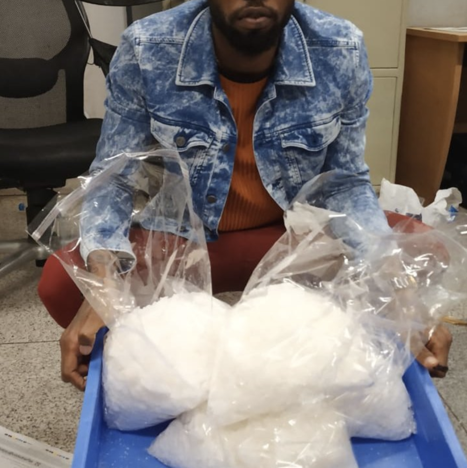 A photo of Mohamed Umar Turay with the amphetamines allegedly found in his bag. Source: CISF