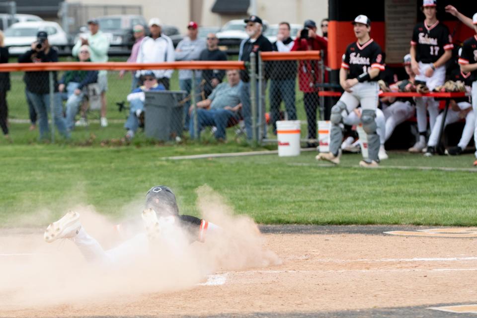 Pennsbury's Charlie Cordisco slides home for a run last spring.
