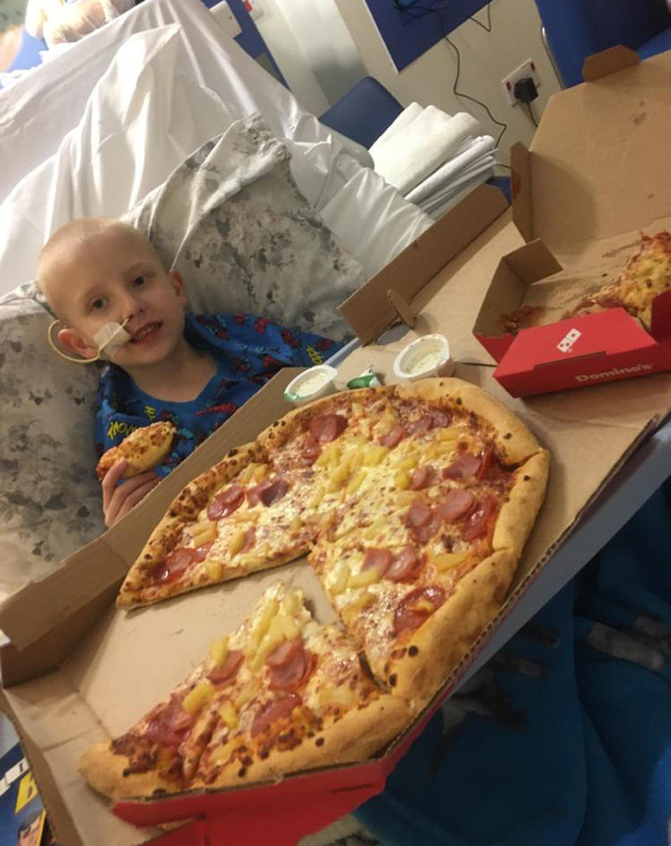 Tommy has a pizza in hospital. (PA Real Life/Collect) 