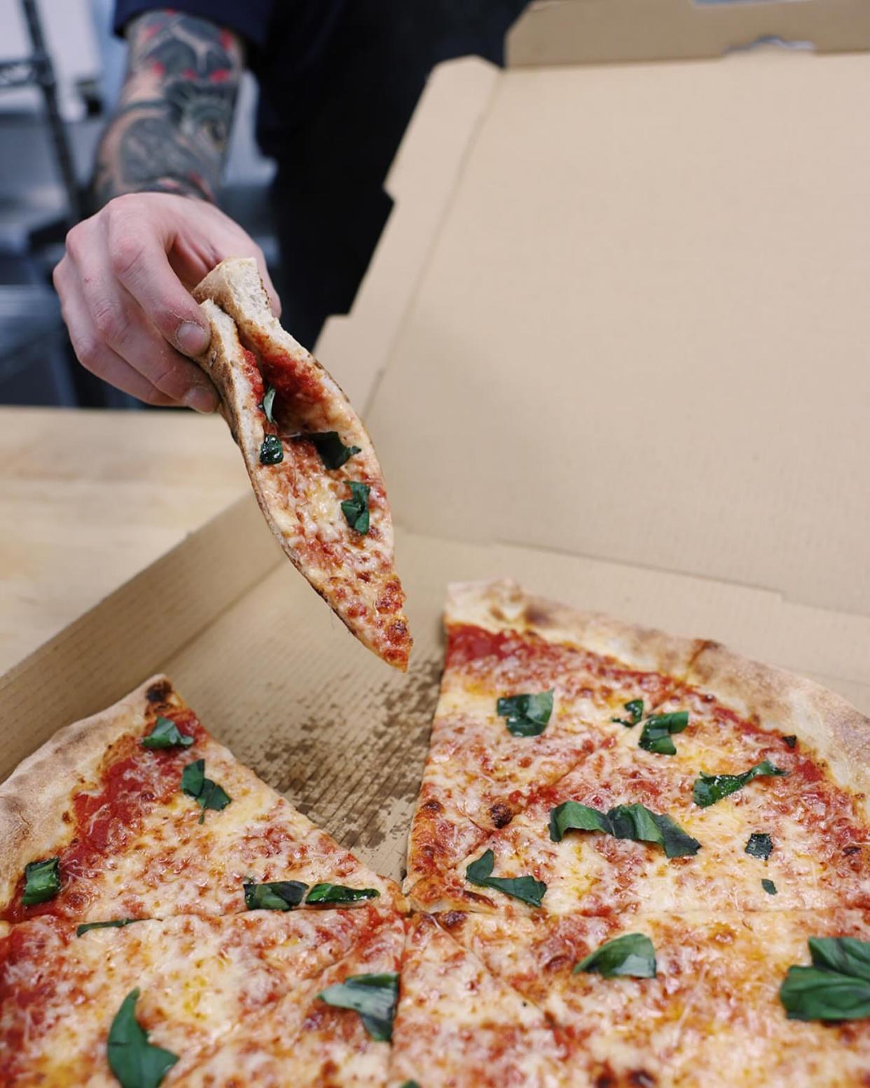 Pizza served up at Mike's Pizza, now open at Deli Ohio in Canton, easily can accomplish the official fold of a New York-style pizza.