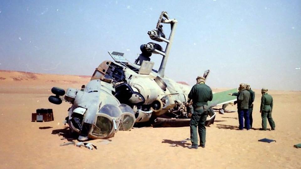 French personnel inspect the remains of another Hind in Chad in the aftermath of the Toyota War. <em>French Army</em>