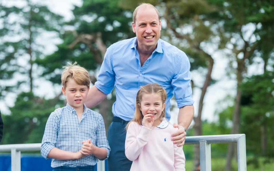 Prince William with Prince George and Princess Charlotte at the start of a half marathon on the Sandringham Estate, Sandringham, - Ian Burt