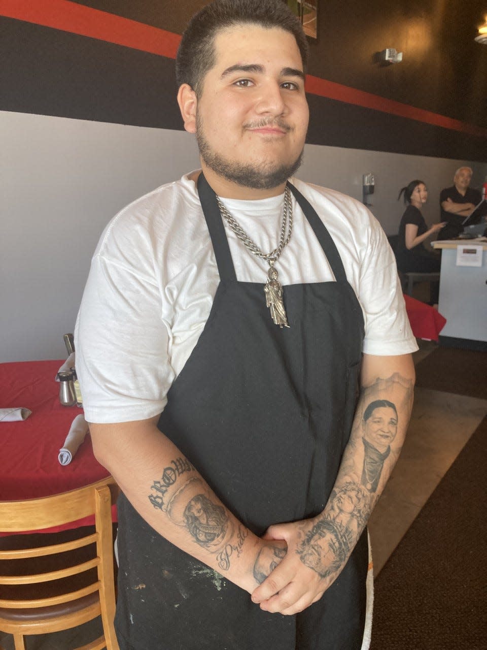 Victoria's Steakhouse and Mexican Grill chef Freddy Marquez, 21, is proud to help run the new restaurant on the far East Side. His grandmother, Rosa Emma Fong, who started the original restaurant, is tattooed on his right arm.