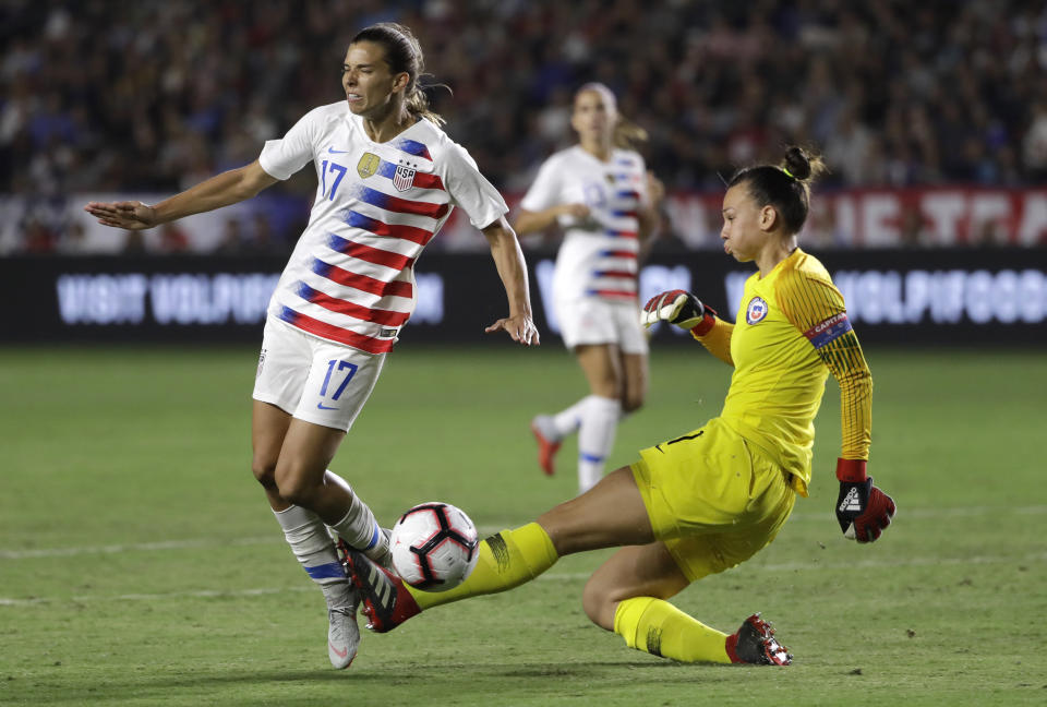 United States' Tobin Heath, left, collides with Chile goalkeeper Christiane Endler during the first half of an international friendly soccer match Friday, Aug. 31, 2018, in Carson, Calif. (AP Photo/Marcio Jose Sanchez)