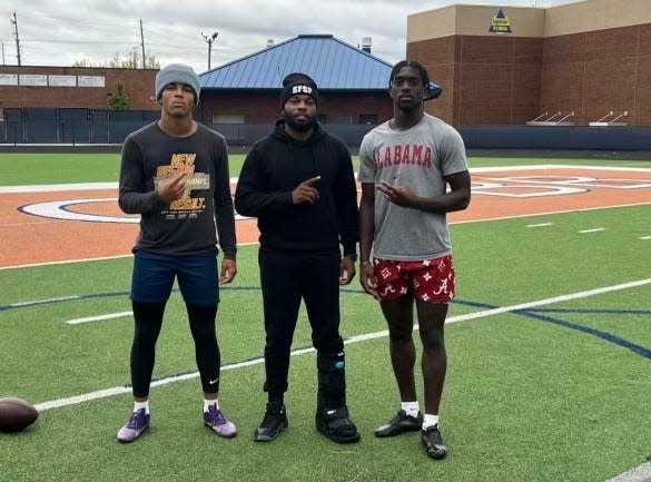 (From left) New Detroit Lions cornerback Terrion Arnold, his trainer, Oliver Davis II, and an Atlanta area high school student pose after a workout during the fall of 2023.