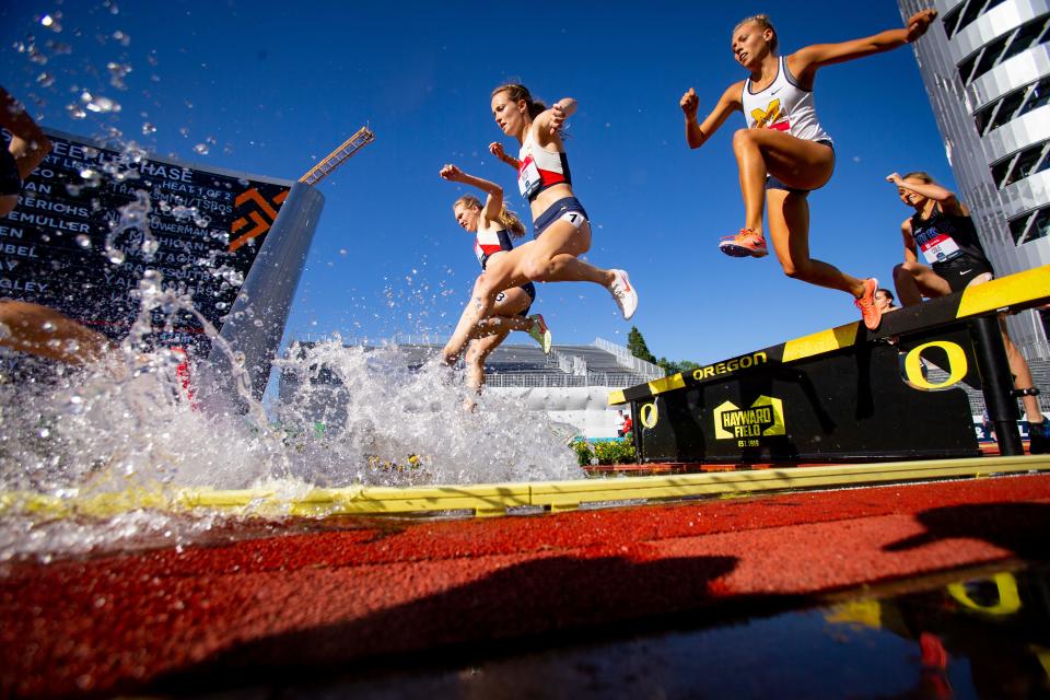 Athletes cross the water jump during the first round of the women’s 3,000 meter steeplechase at the USA Track and Field Championships Friday, June 24, 2022, at Hayward Field in Eugene, Ore. 