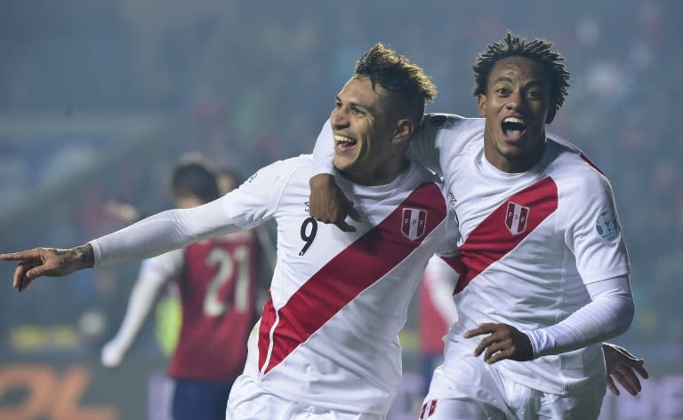 Peru's Paolo Guerrero (L) celebrates with teammate Andre Carrillo after scoring a goal against Paraguay, during their Copa America 3rd place match, in Concepcion, Chile, on July 3, 2015