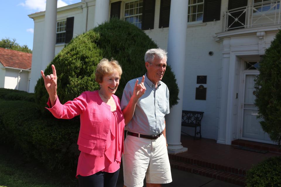 Suzanne Shipley and her husband Randy listen as members of the MSU band play the alma matter for the retiring university president at the Sikes House, Aug. 30, 2021. Shipley's last day was Aug. 31.