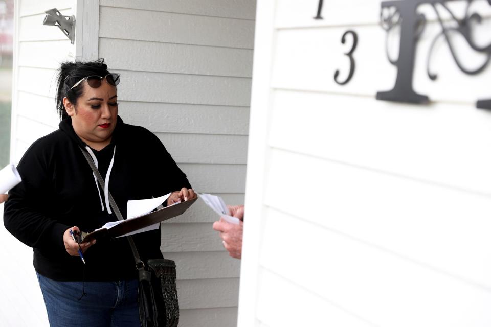 Aumsville mayor Angelica Ceja goes door to door to inform residents of a potential increase in their water bills and city efforts to find funding for a $28 million wastewater facility.