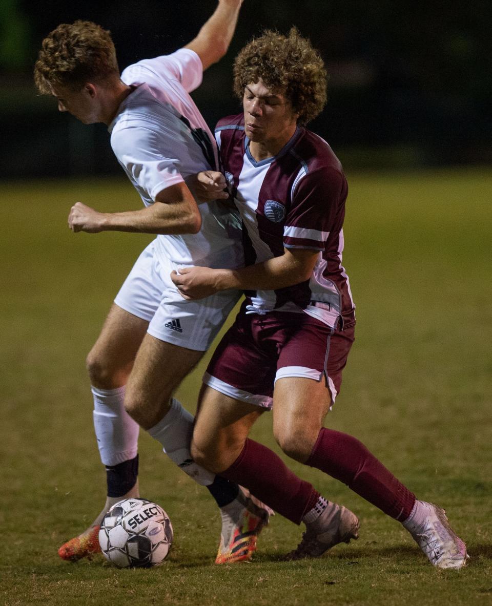 Madisonville's Logan Terry (6) is forced off the ball by Henderson's Braeden Myers-Curry (19) as the Henderson County Colonels face the Madisonville-North Hopkins Maroons in the 2nd Region Soccer Tournament semifinals at the Stadium of Champions in Hopkinsville, Ky., Wednesday evening, Oct. 13, 2021.