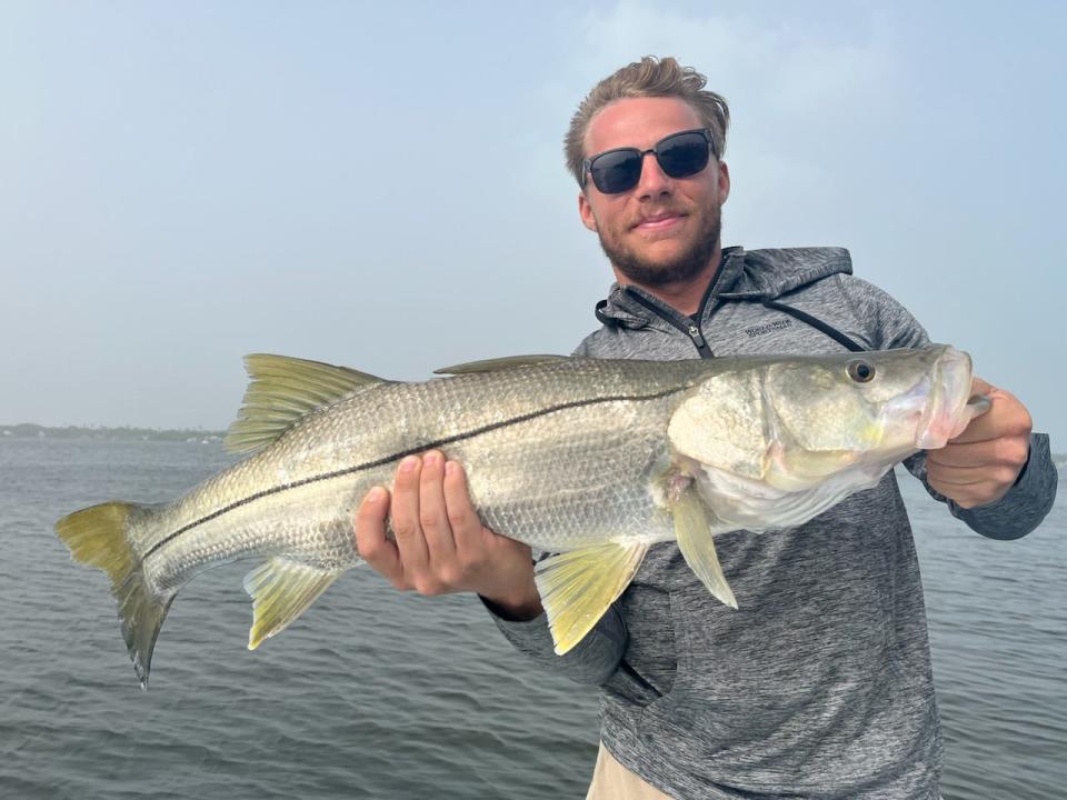 A slot-sized snook was caught by this visiting angler with Capt. Mark Dravo of Y-B Normal Charters on Oct. 3, 2023 in Fort Pierce. A proposed rule from FWC would make a two-fish vessel limit for snook statewide.