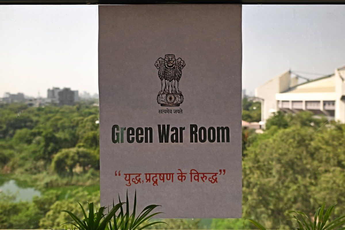 A sheet reading ‘green war room’ is stuck on a window of the designated room at Delhi secretariat (AFP via Getty Images)