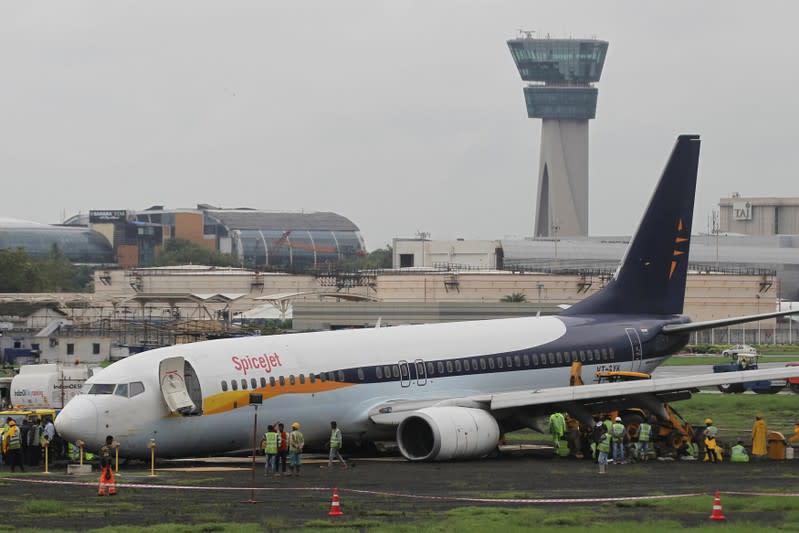 A SpiceJet Boeing 737-800 airplane is seen after it overshot the runway while landing due to heavy rains at an airport in Mumbai