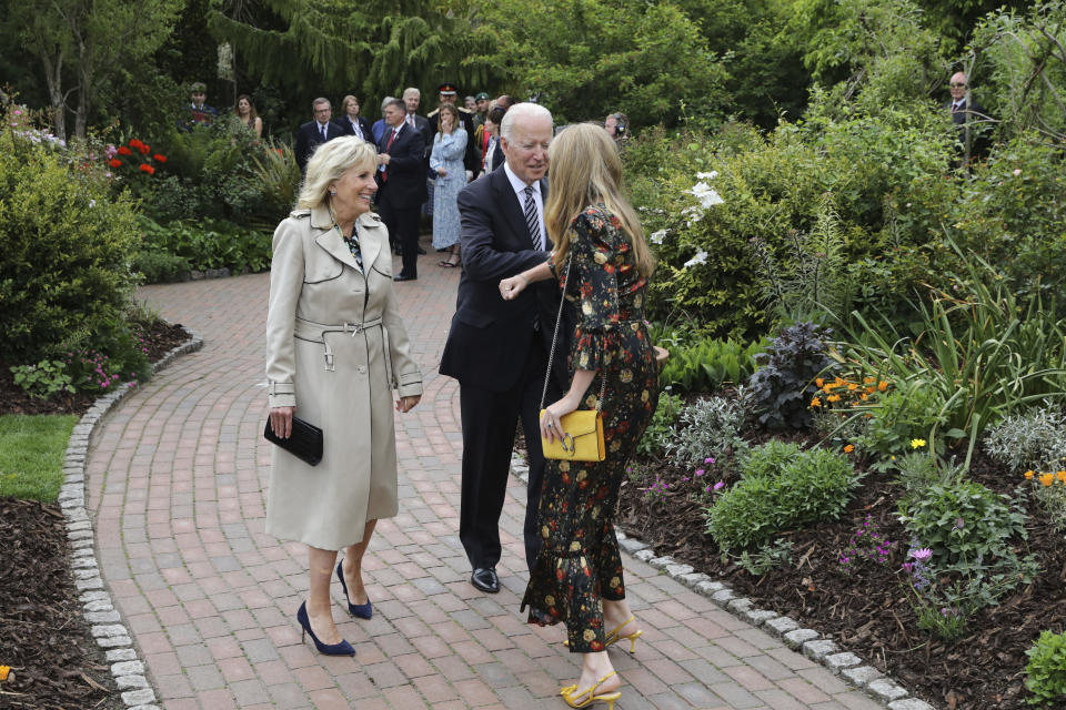 Carrie Johnson, wife of Britain's Prime Minister Boris Johnson, greets US President Joe Biden and his wife Jill Biden at a reception with the G7 leaders at the Eden Project in Cornwall, England, Friday June 11, 2021, during the G7 summit. (Jack Hill/Pool via AP)