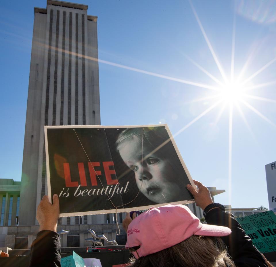 Abortion-rights and anti-abortion activists voice their opinions outside the Florida Supreme Court after the Court heard arguments on the proposed abortion amendment Wednesday, Feb. 7, 2024.