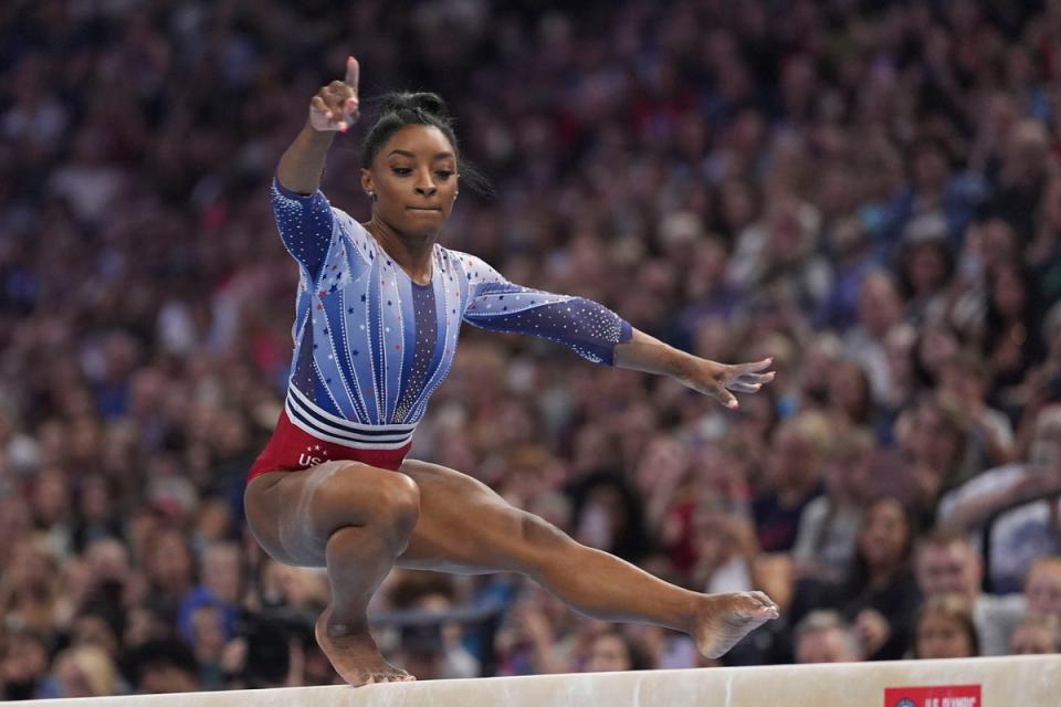 Simone Biles competes on the balance beam at the U.S. Olympic gymnastics trials Friday, June 28, 2024, in Minneapolis (AP)