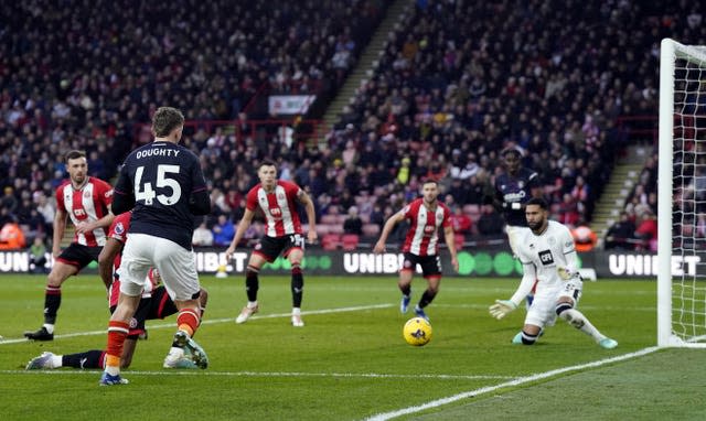 Alfie Doughty beats Wes Foderingham at his near post 