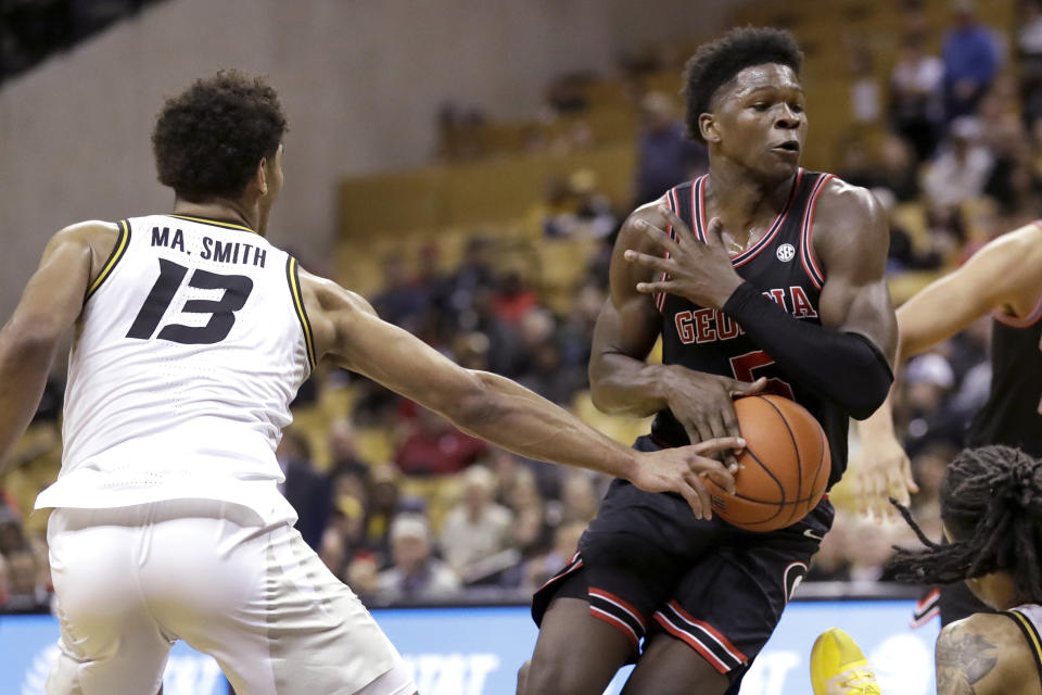 Georgia's Anthony Edwards heads to the basket as Missouri's Mark Smith (13) defends during the first half of an NCAA college basketball game Tuesday, Jan. 28, 2020, in Columbia, Mo. (AP Photo/Jeff Roberson)