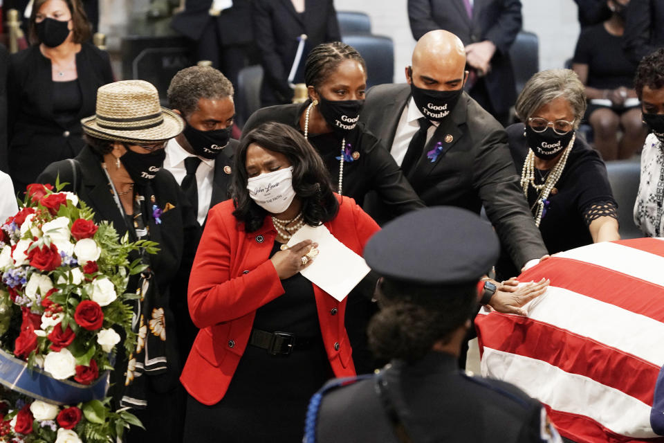 Rep. Terri Sewell, D-D-Ala., and other members of the Congressional Black Caucus, depart at the conclusion of a service for the late Rep. John Lewis, a key figure in the civil rights movement and a 17-term congressman from Georgia, as he lies in state at the Capitol in Washington, Monday, July 27, 2020. (AP Photo/J. Scott Applewhite, Pool)