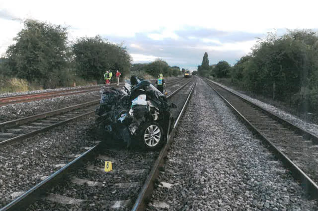 car left on tracks hit by train