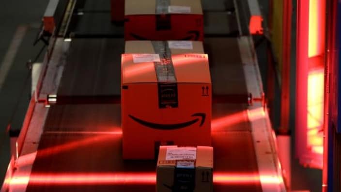 Packages riding on a belt are scanned to be loaded onto delivery trucks at the Amazon Fulfillment center in Robbinsville Township, N.J. Federal work-safety investigators are looking into the death of an Amazon worker and an injury that potentially led to the death of another employee, adding to a probe already underway following a third fatality during the company’s annual Prime Day shopping event in mid-July. (Photo: Julio Cortez/AP, File)