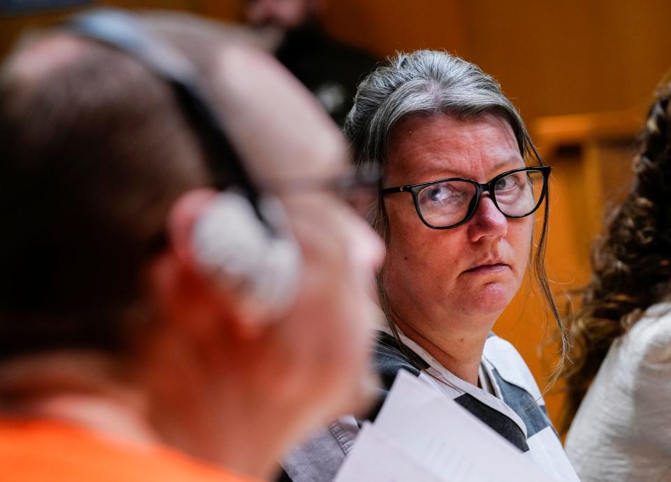 Jennifer Crumbley shoots her husband James Crumbley a glance during their sentencing hearing in the Oakland County courtroom of Cheryl Matthews on Tuesday, April 9, 2024. The Crumbleys were found guilty each on four counts of involuntary manslaughter.