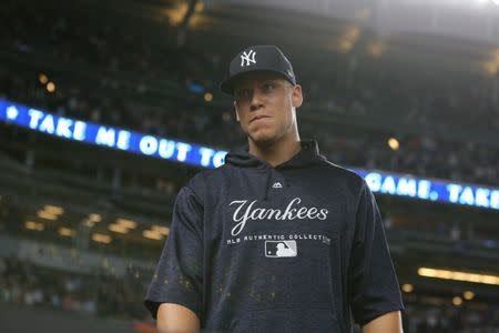 FILE PHOTO: Jul 31, 2018; Bronx, NY, USA; New York Yankees injured right fielder Aaron Judge (99) stands on the field just outside the dugout during the seventh inning stretch of a game against the Baltimore Orioles at Yankee Stadium. Mandatory Credit: Brad Penner-USA TODAY Sports