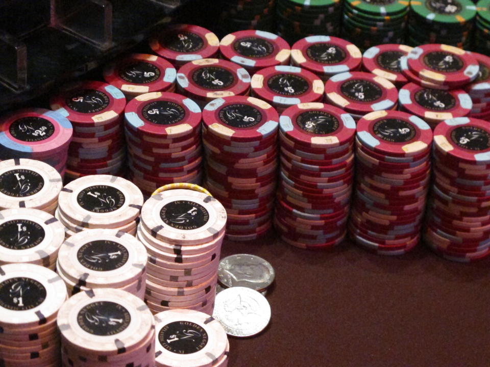 This Feb. 22, 2019 photo shows stacks of gambling chips at the Golden Nugget casino in Atlantic City N.J. New Jersey's casinos and horse tracks won $97.5 million in June, a decline of 65.6% from a year earlier during the final month of being closed due to the coronavirus outbreak. (AP Photo/Wayne Parry)