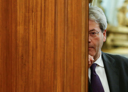 Italian Prime Minister-designate Paolo Gentiloni leaves at the end of a meeting at the Low Chamber in Rome, Italy December 12, 2016. REUTERS/Remo Casilli