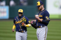 Milwaukee Brewers starting pitcher Brett Anderson looks down at his hand before leaving with an injury during the third inning of a baseball game against the St. Louis Cardinals Sunday, Sept. 27, 2020, in St. Louis. (AP Photo/Jeff Roberson)