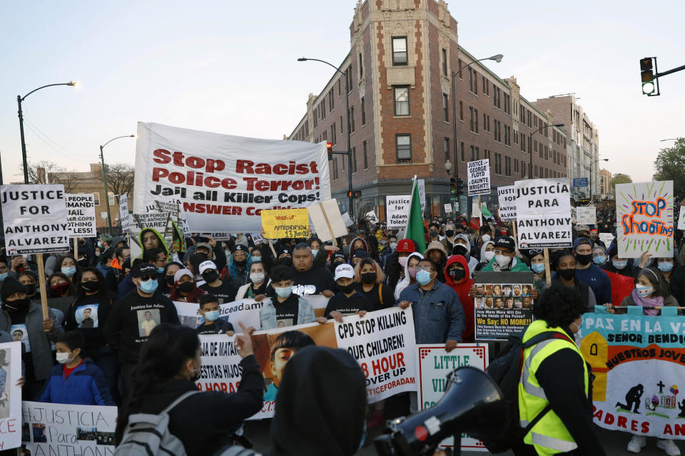 Demonstrators protest the shooting of 13-year-old Adam Toledo, Friday, April 16, 2021, in Logan Park in Chicago. Toledo was shot to death by an officer on March 29 in an alley west of the 2300 block of South Sawyer Avenue in Little Village on the Southwest Side. (AP Photo/Shafkat Anowar)