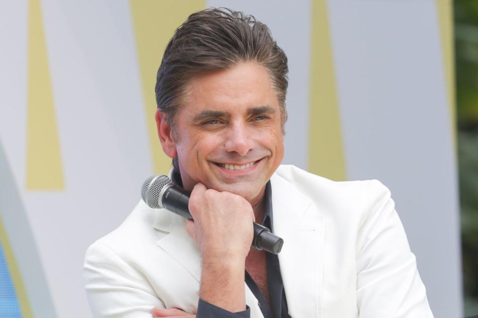 <p>Mireya Acierto/Getty</p> John Stamos at the Tribeca Storytellers: John Stamos at the Tribeca Music Lounge during Art Basel Miami Beach in December 2023