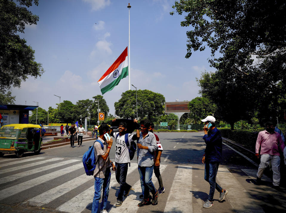 Image: The Indian flag flies at half-mast at the Central Park in Connaught Place following Thursday's death of Britain's Queen Elizabeth II in New Delhi on Sept.11, 2022. (Manish Swarup / AP)