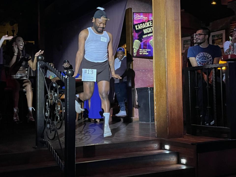 Leo Ahmon, 26, walks the cheer performance-themed category at vogue night at Stacy's at Melrose on Aug. 4, 2022.