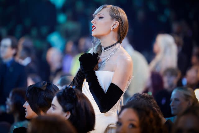 <p>Francis Specker/CBS</p> Taylor Swift on her feet during the 66th annual Grammy Awards