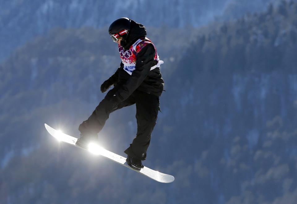 Austria's Clemens Schattschneider performs a jump during the men's snowboard slopestyle qualifying session at the 2014 Sochi Olympic Games in Rosa Khutor February 6, 2014. REUTERS/Lucas Jackson (RUSSIA - Tags: OLYMPICS SPORT SNOWBOARDING TPX IMAGES OF THE DAY)
