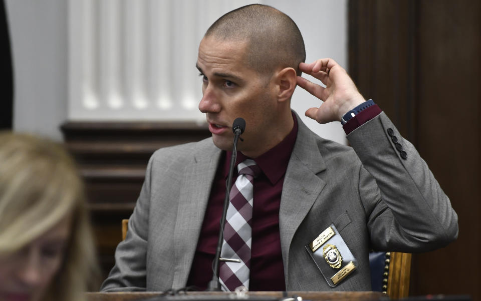 Kenosha Police Department Detective Martin Howard points to his head where Kyle Rittenhouse was hurt on Aug. 25, 2020, while he testifies during the trial at the Kenosha County Courthouse in Kenosha, Wis., on Wednesday, Nov. 3 2021. Rittenhouse is accused of killing two people and wounding a third during a protest over police brutality in Kenosha, last year. (Sean Krajacic/The Kenosha News via AP, Pool)