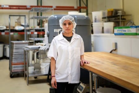 FILE PHOTO: Liliana Barrios poses for a photo at her place of employment in Redwood City, California, U.S., October 10, 2018.    REUTERS/Elijah Nouvelage