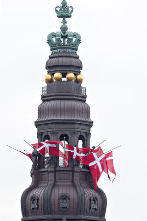 The flag of Denmark is seen at the Danish Parliament in Christiansborg Palace during the funeral of Prince Henrik in Copenhagen, Denmark February 20, 2018. Ritzau Scanpix Denmark/Jens Noergaard Larsen/via REUTERS