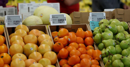 Prices are displayed on digital price tags at a 365 by Whole Foods Market grocery store ahead of its opening day in Los Angeles, U.S., May 24, 2016. REUTERS/Mario Anzuoni