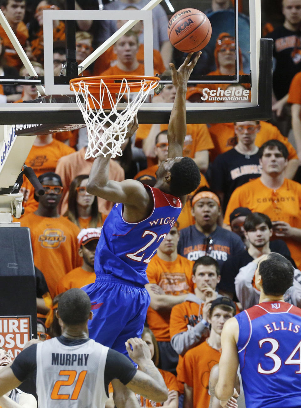 Kansas guard Andrew Wiggins (22) shoots in front of Oklahoma State post Kamari Murphy (21) in the second half of an NCAA college basketball game in Stillwater, Okla., Saturday, March 1, 2014. Oklahoma State won 72-65. (AP Photo/Sue Ogrocki)