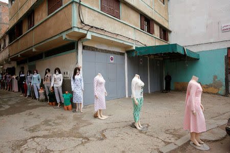 Mannequins displaying women's clothing for sale are lined in the street at the market in Ouled Moussa district, on the outskirts of Rabat, Morocco April 24, 2018. REUTERS/Youssef Boudlal