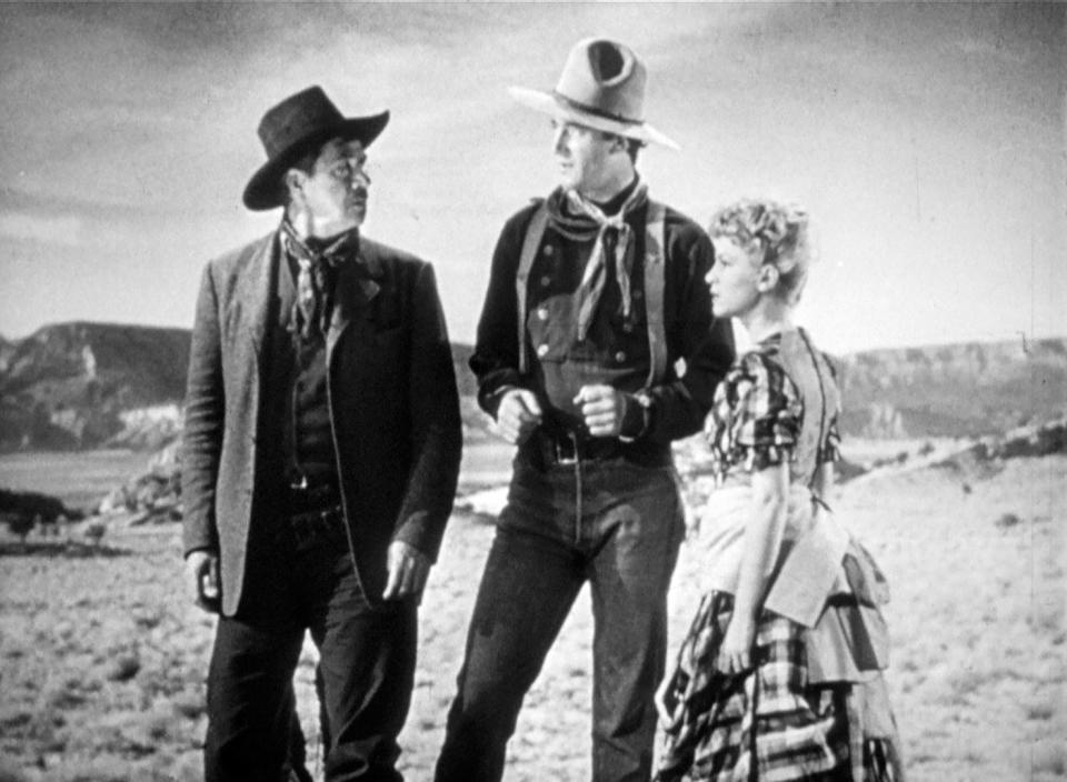 George Bancroft as Curley, John Wayne as the Ringo Kid and Claire Trevor as Dallas in a scene from the 1939 movie "Stagecoach."