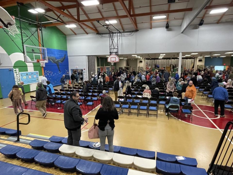 Brewster voters exit the cafetorium at the Stony Brook Elementary School after four hours of annual town meeting deliberations.
