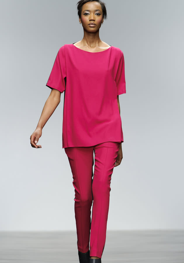 <b>London Fashion Week AW13: Zoe Jordan</b><br><br>A Zoe Jordan model shows off a raspberry-coloured shift tee and tailored trousers on the catwalk.<br><br>©Rex