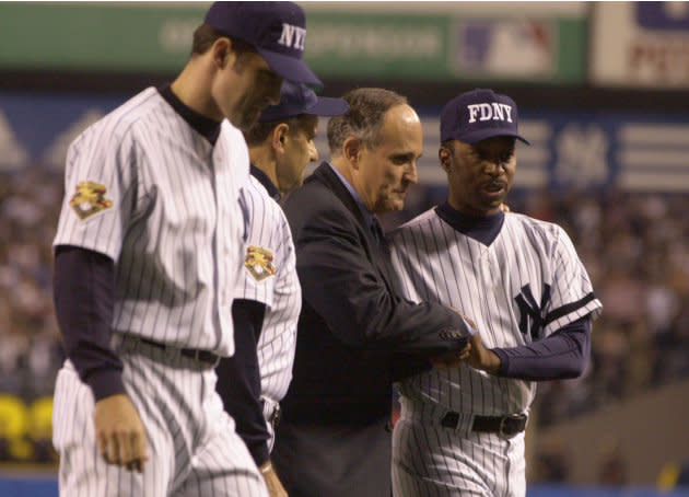 Former New York City Mayor Rudolph Giuliani shakes hands with Willie Randolph in the first baseball game played at Yankee Stadium after the 9/11terrorist attacks. (Ezra Shaw/Allsport/Getty Images)