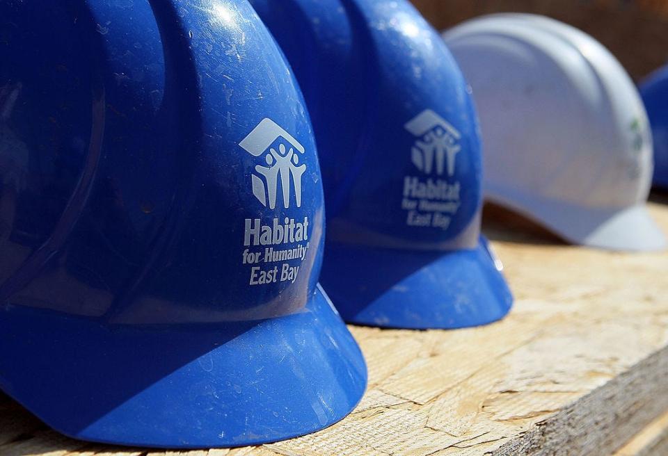 habitat for humanity OAKLAND, CA - APRIL 16: Hard hats with the Habitat for Humanity logo sit on a table at a construction site April 16, 2010 in Oakland, California. Habitat for Humanity East Bay kicked off their five-day Earth Day Build-A-Thon where they hope to fully frame 10 homes with the help of hundreds of volunteers. (Photo by Justin Sullivan/Getty Images)