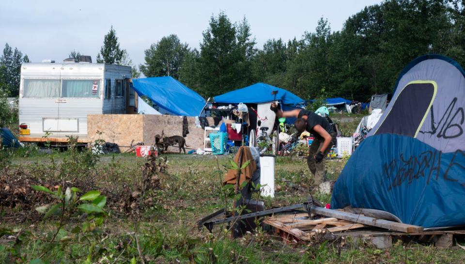 A homeless man at an encampment.